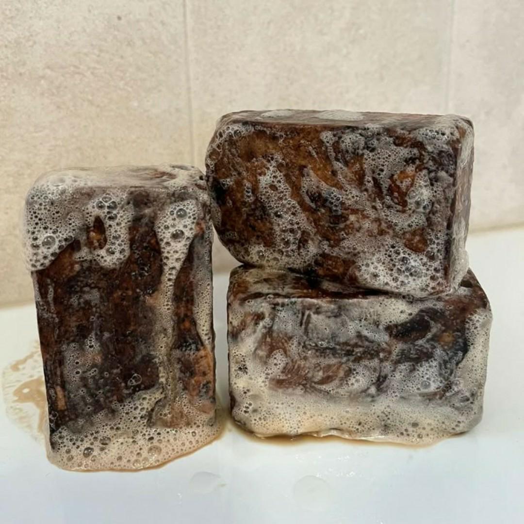 African black soap is a natural, organic soap traditionally made in West Africa from plant-based ingredients like palm oil, shea butter, and cocoa pod ash. It's known for its deep cleansing and exfoli