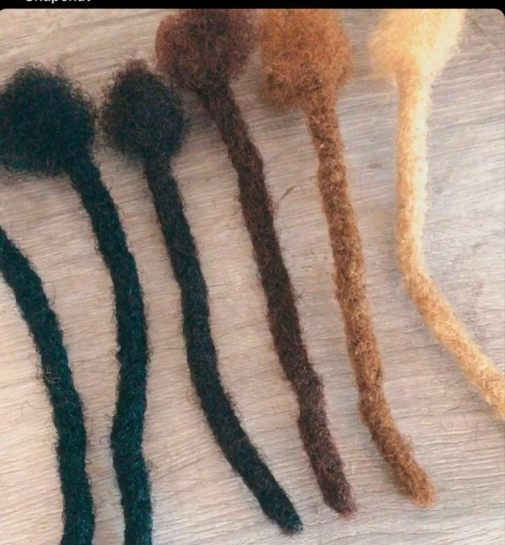 Artificial dreadlocks Artificial dreadlock extensions are pre-made dreadlock-like strands, typically made of synthetic hair, that are attached to natural hair to create the appearance of dreadlocks wi