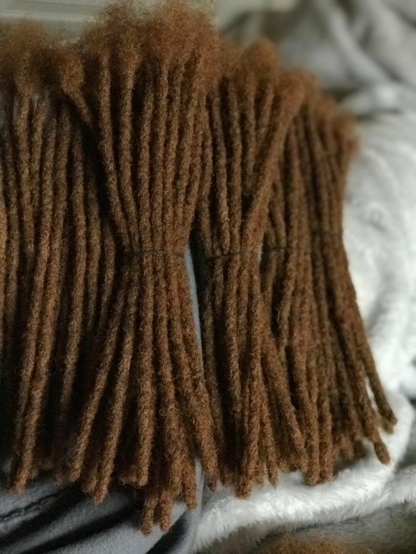 Artificial dreadlocks Artificial dreadlock extensions are pre-made dreadlock-like strands, typically made of synthetic hair, that are attached to natural hair to create the appearance of dreadlocks wi