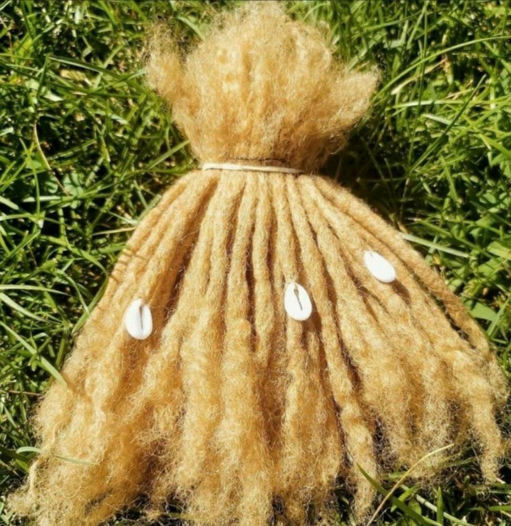 Artificial dreadlock extensions are pre-made dreadlock-like strands, typically made of synthetic hair, that are attached to natural hair to create the appearance of dreadlocks without the long-term co