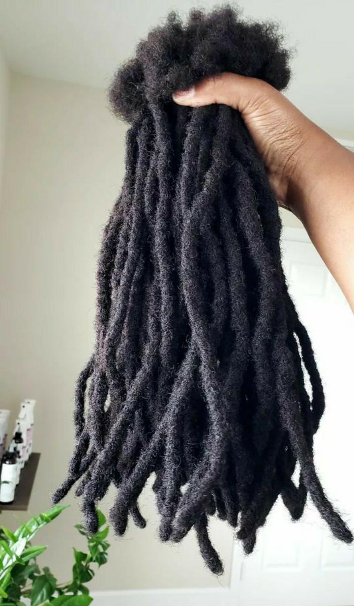Artificial dreadlock extensions are pre-made dreadlock-like strands, typically made of synthetic hair, that are attached to natural hair to create the appearance of dreadlocks without the long-term co