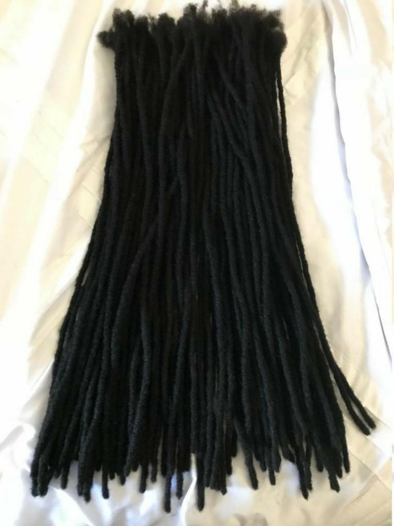 Artificial dreadlock extensions are pre-made dreadlock-like strands, typically made of synthetic hair, that are attached to natural hair to create the appearance of dreadlocks without the long-term co