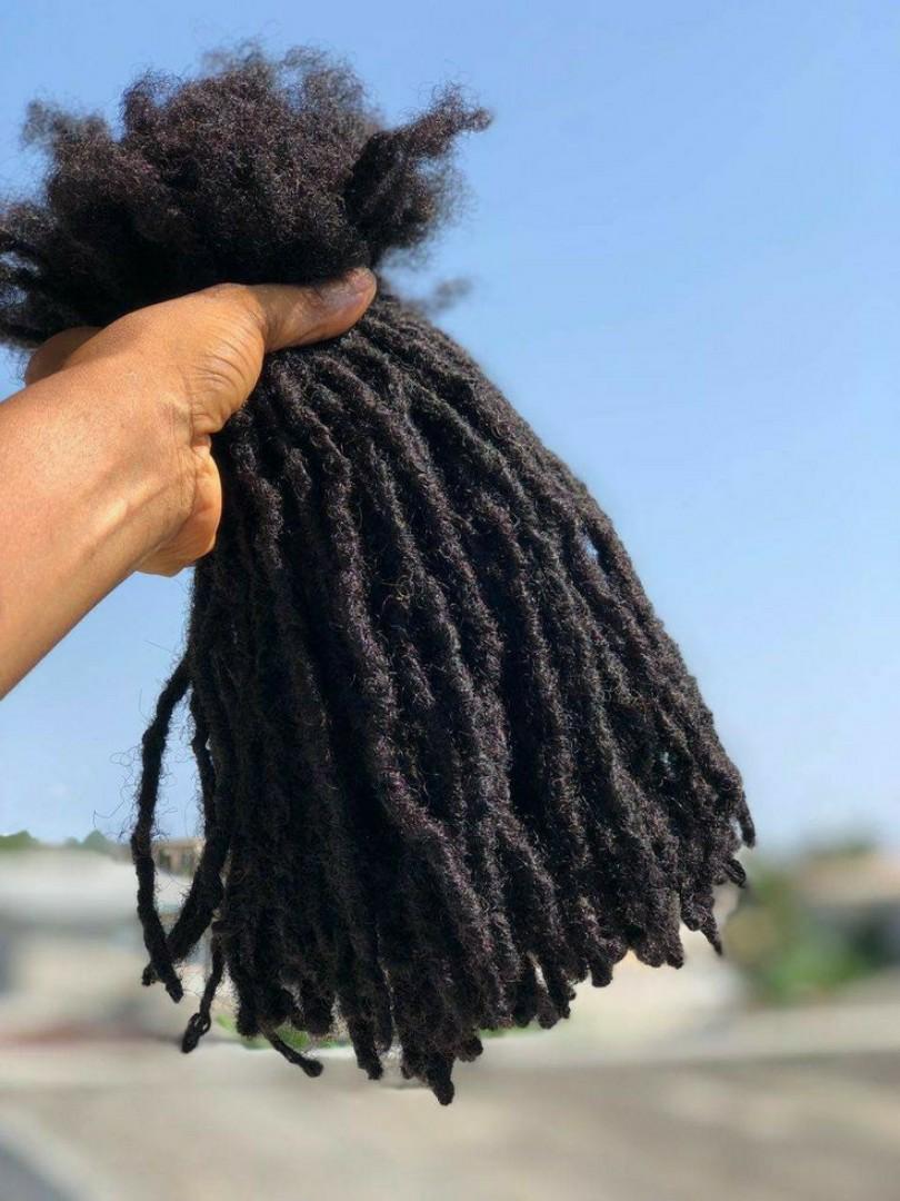 Artificial dreadlock extensions are pre-made dreadlock-like strands, typically made of synthetic hair, that are attached to natural hair to create the appearance of dreadlocks without the long-term co