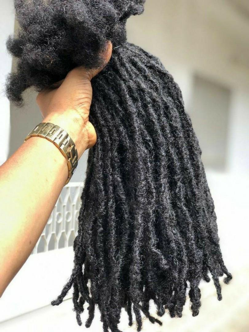 Artificial dreadlock extensions are pre-made dreadlock-like strands, typically made of synthetic hair, that are attached to natural hair to create the appearance of dreadlocks without the long-term co