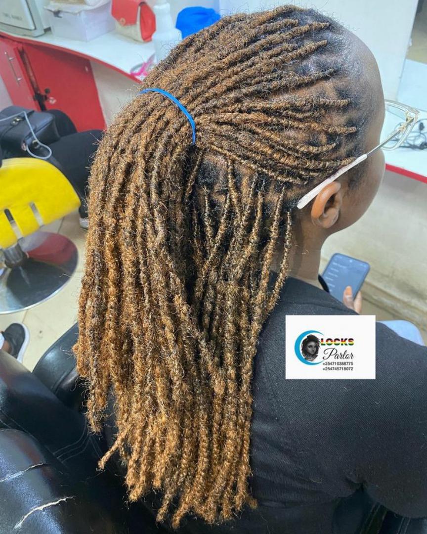 Ug locs 80pieces.Ug locs extensions" refers to dreadlock extensions installed by loc specialists in Uganda, often using artificial dreadlock extensions or natural human hair to add length and volume t