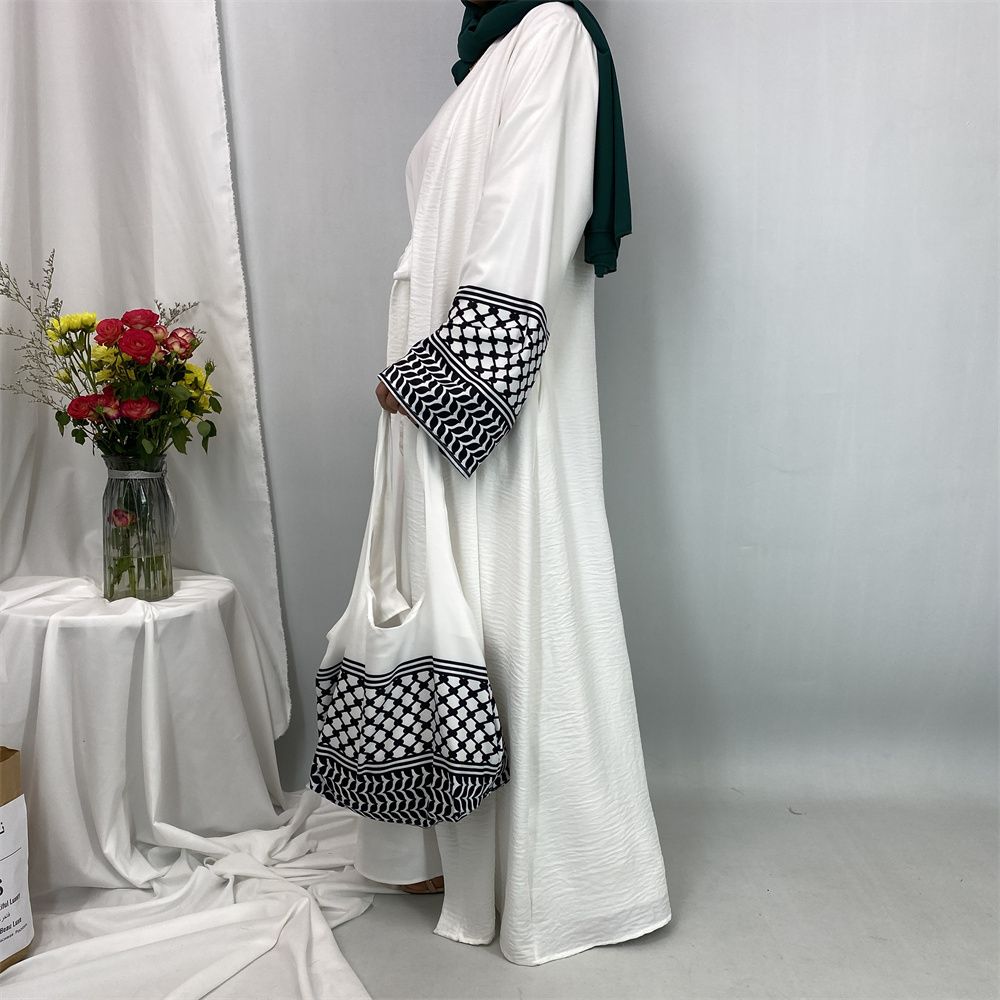 A new fashionable cardigan dress for Middle Eastern Muslims in Dubai, Turkey and Arabia during Ramadan, paired with a mini bag