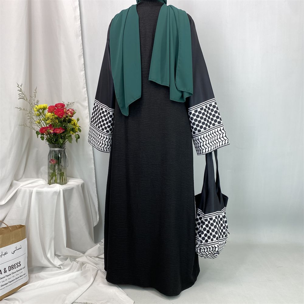A new fashionable cardigan dress for Middle Eastern Muslims in Dubai, Turkey and Arabia during Ramadan, paired with a mini bag