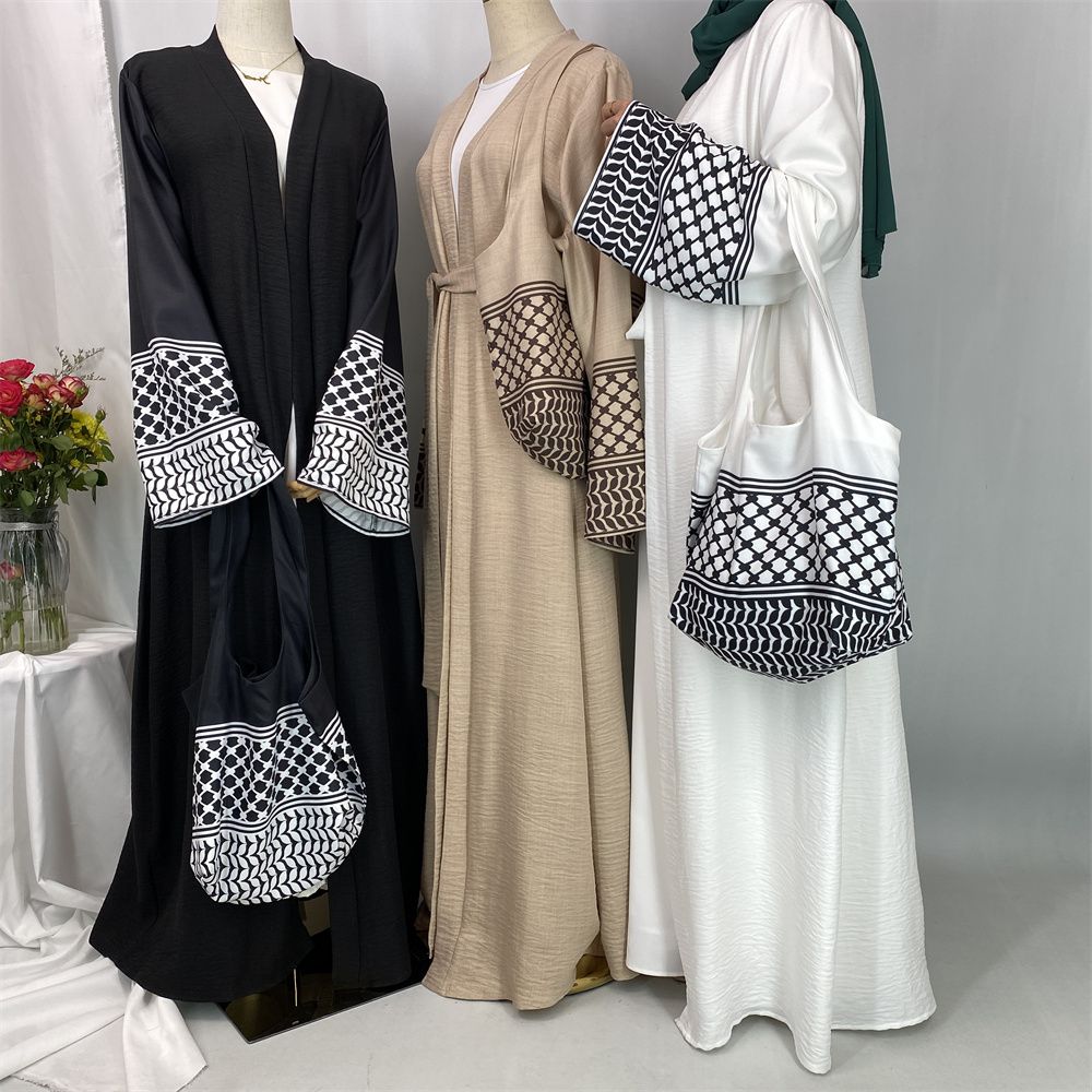 A new fashionable cardigan dress for Middle Eastern Muslims in Dubai, Turkey and Arabia during Ramadan, paired with a mini bag