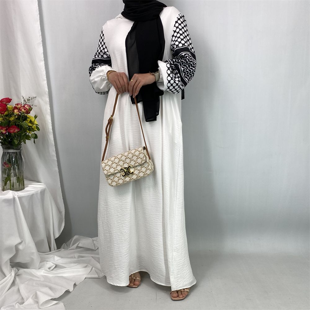Turkish Muslim fashion women's dress with a hat in Dubai, Middle East, and Islamic elegant women's long dress