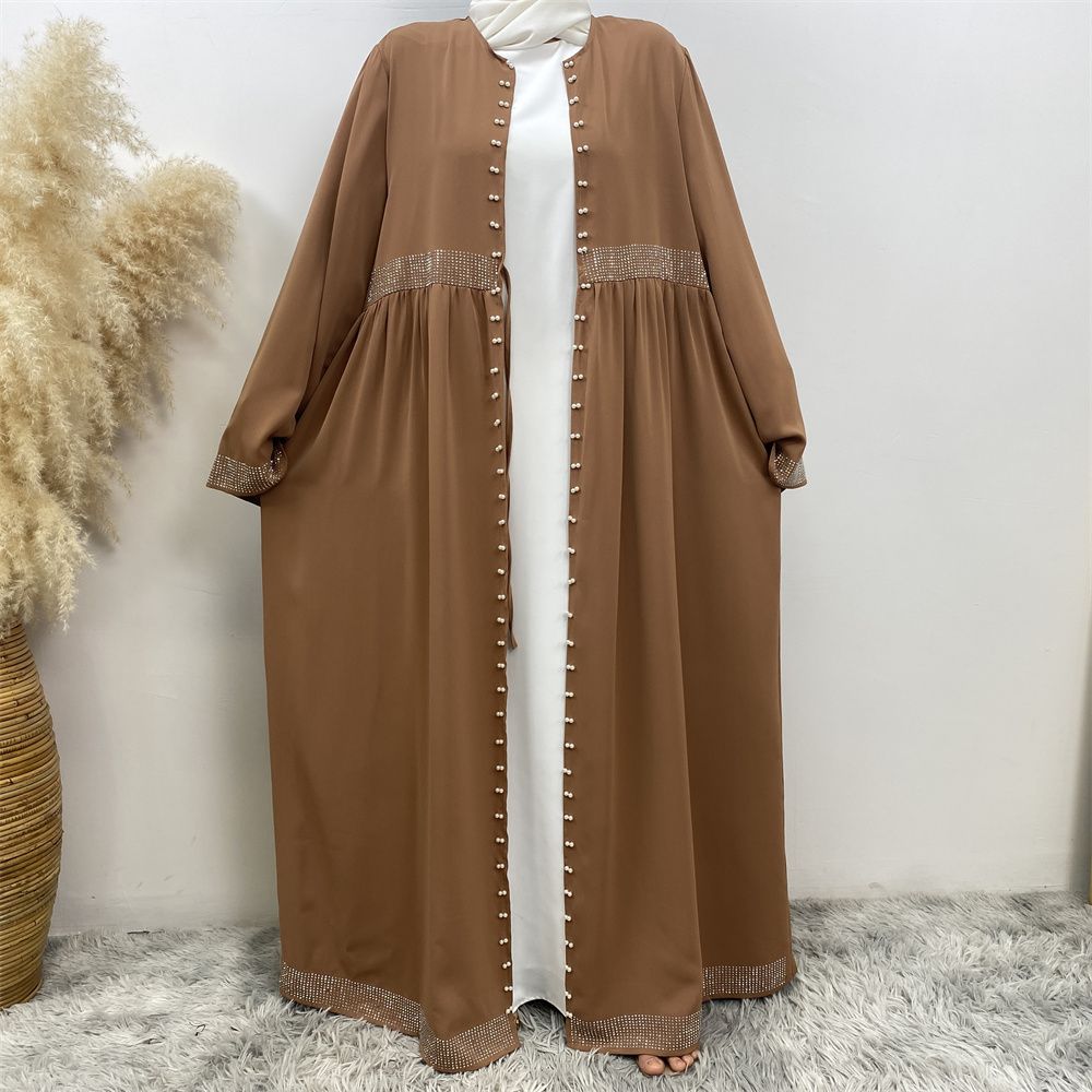 The Middle Eastern Muslim Ramadan is elegant and refined, with diamond and beaded designs. The Muslim cardigan from Turkey and Dubai is a fashionable long dress with pockets