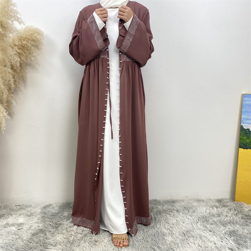 The Middle Eastern Muslim Ramadan is elegant and refined, with diamond and beaded designs. The Muslim cardigan from Turkey and Dubai is a fashionable long dress with pockets