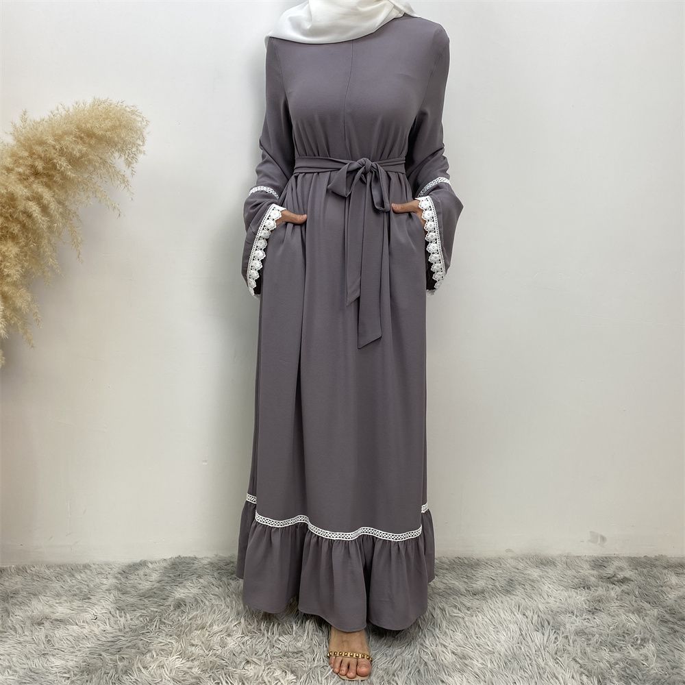 A Muslim Dubai Turkish Arab dress with white lace and front zipper and large hem is on sale in East Dubai