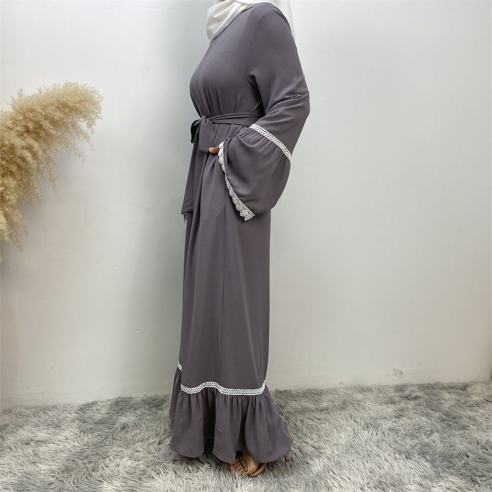 A Muslim Dubai Turkish Arab dress with white lace and front zipper and large hem is on sale in East Dubai