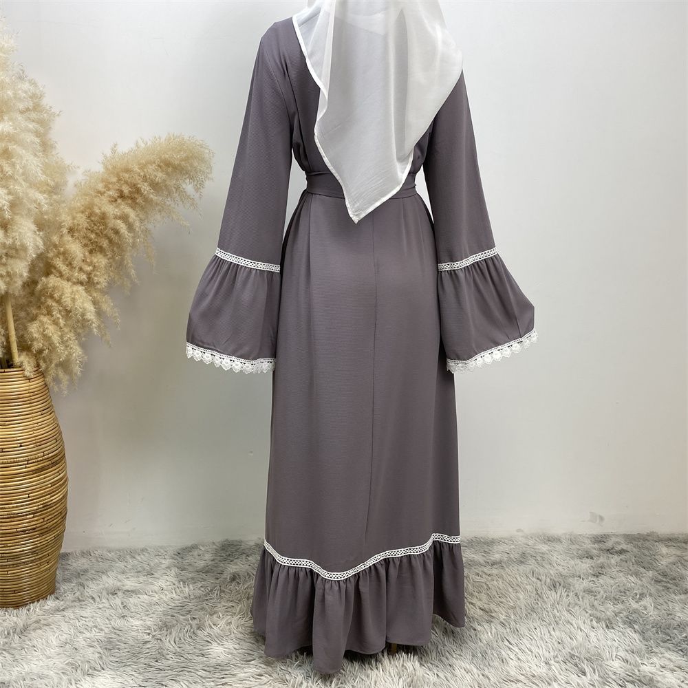 A Muslim Dubai Turkish Arab dress with white lace and front zipper and large hem is on sale in East Dubai