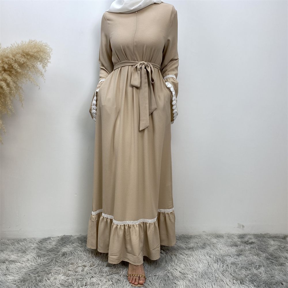 A Muslim Dubai Turkish Arab dress with white lace and front zipper and large hem is on sale in East Dubai