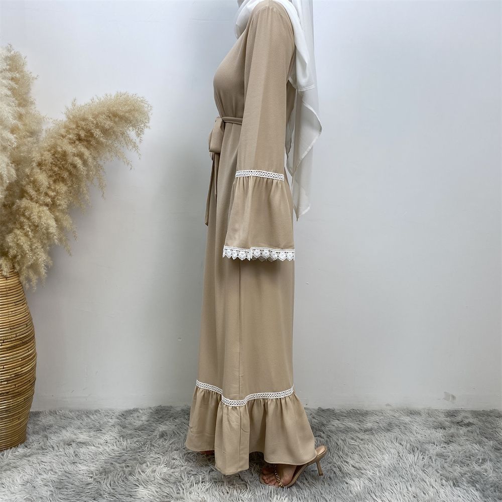 A Muslim Dubai Turkish Arab dress with white lace and front zipper and large hem is on sale in East Dubai