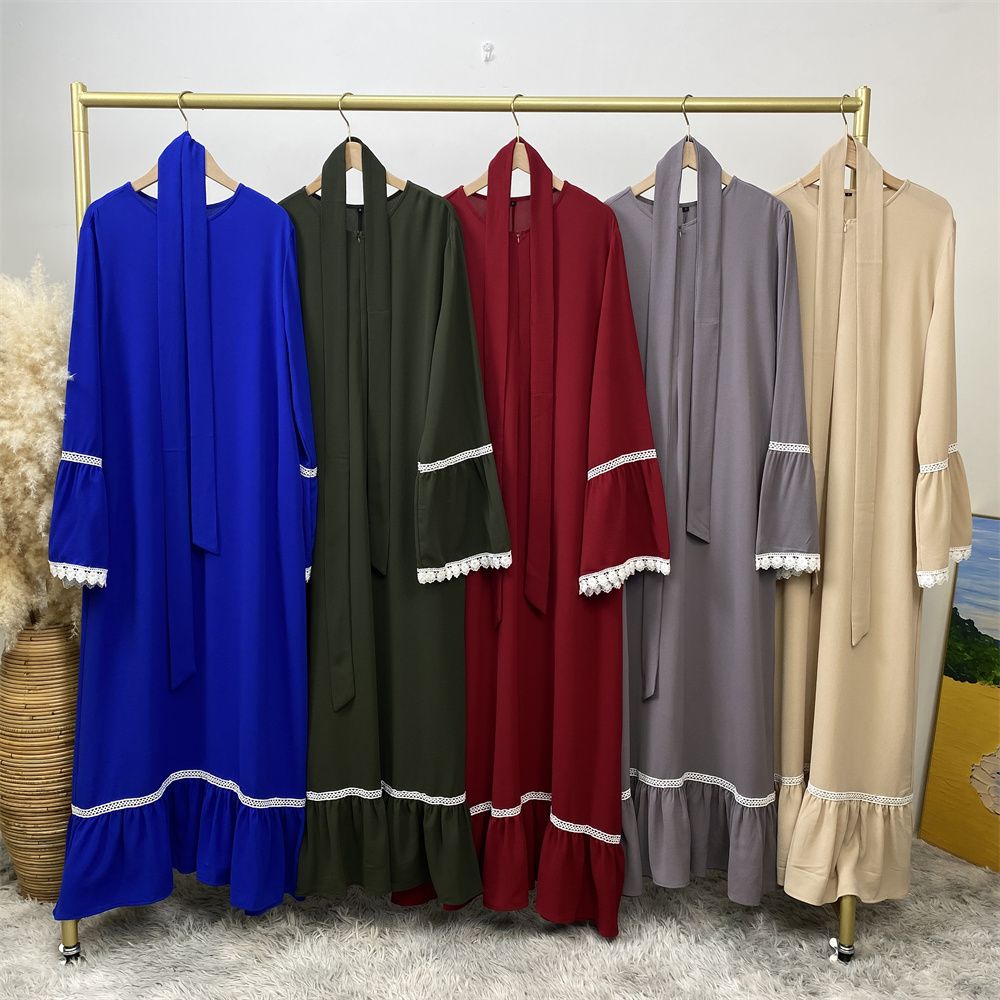A Muslim Dubai Turkish Arab dress with white lace and front zipper and large hem is on sale in East Dubai