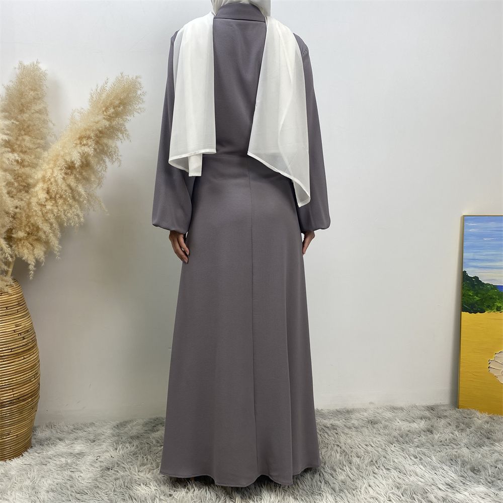 The Muslim Middle East is selling a summer chiffon long dress in solid color with loose buttons and pockets