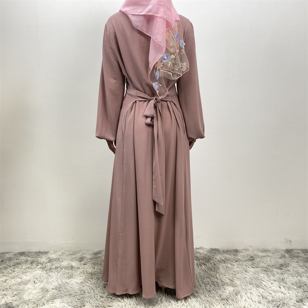 The Muslim Middle East is selling a summer chiffon long dress in solid color with loose buttons and pockets