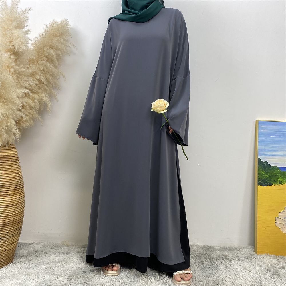 A Muslim solid-color dress with a split shoulder sleeve is selling well in Dubai, Middle East