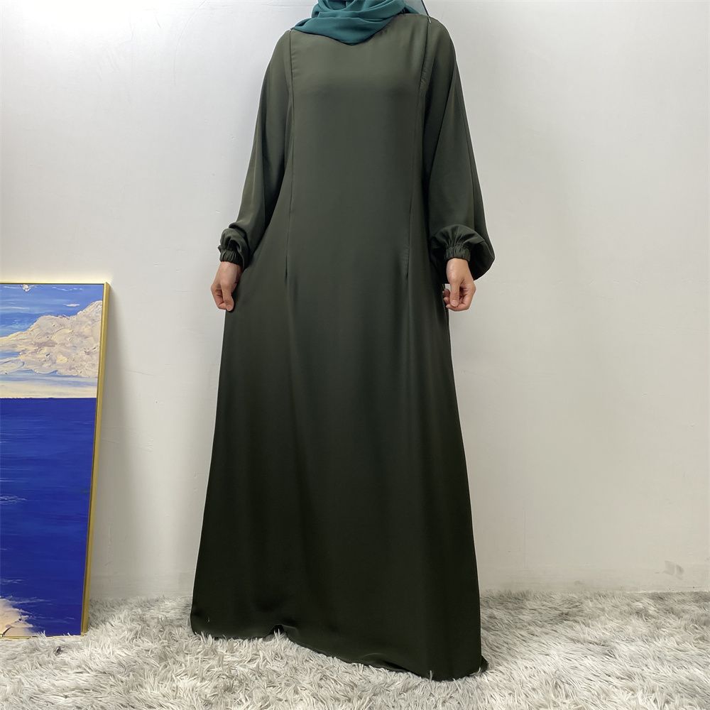 A slit, solid-color, one-shoulder sleeved Muslim dress is selling well in Dubai, Middle East