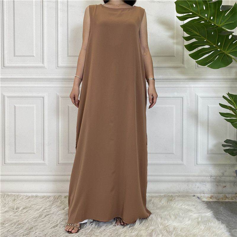 A new Muslim dress with a simple sleeveless base made of plain Nida fabric, which is selling well in the Middle East, Dubai, Arab and African regions
