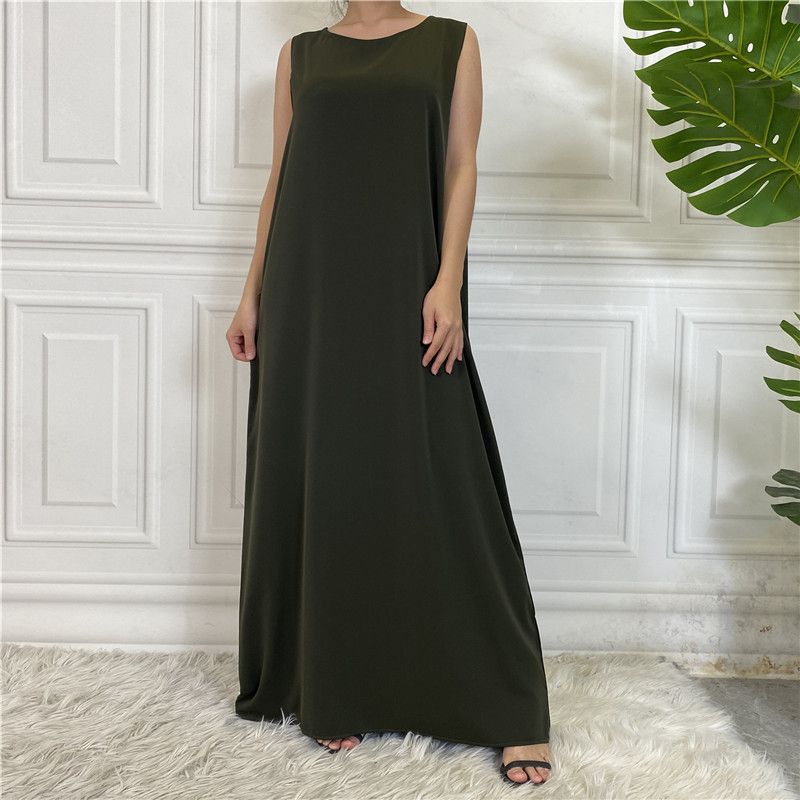 A new Muslim dress with a simple sleeveless base made of plain Nida fabric, which is selling well in the Middle East, Dubai, Arab and African regions