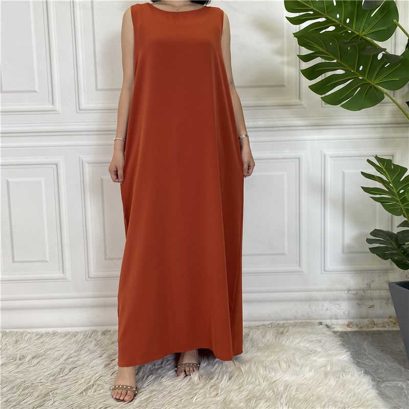 A new Muslim dress with a simple sleeveless base made of plain Nida fabric, which is selling well in the Middle East, Dubai, Arab and African regions