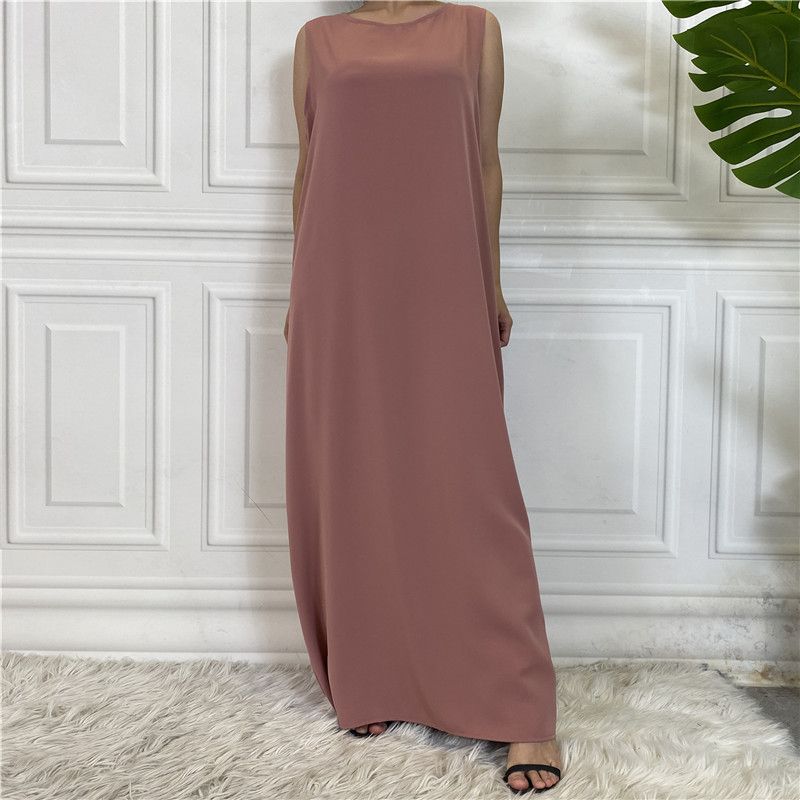 A new Muslim dress with a simple sleeveless base made of plain Nida fabric, which is selling well in the Middle East, Dubai, Arab and African regions