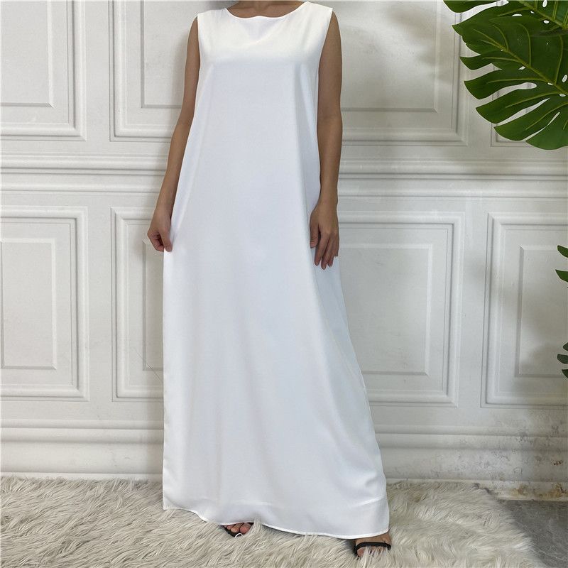 A new Muslim dress with a simple sleeveless base made of plain Nida fabric, which is selling well in the Middle East, Dubai, Arab and African regions