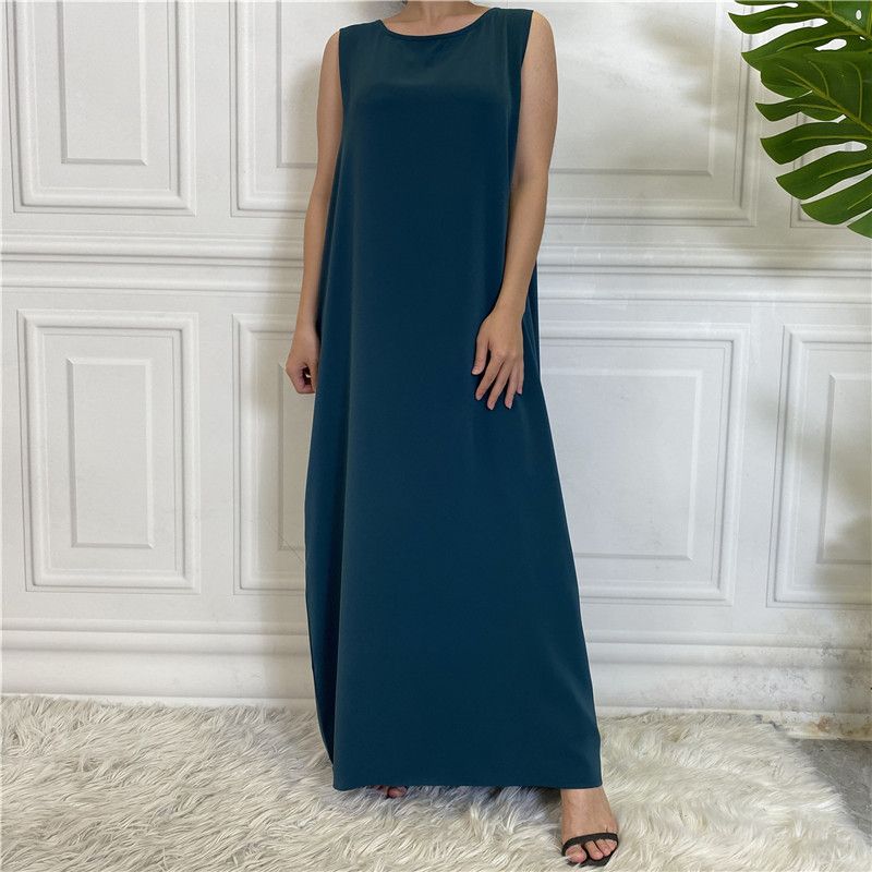 A new Muslim dress with a simple sleeveless base made of plain Nida fabric, which is selling well in the Middle East, Dubai, Arab and African regions