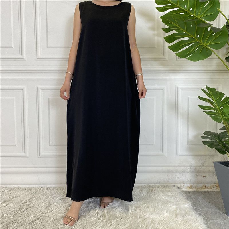A new Muslim dress with a simple sleeveless base made of plain Nida fabric, which is selling well in the Middle East, Dubai, Arab and African regions