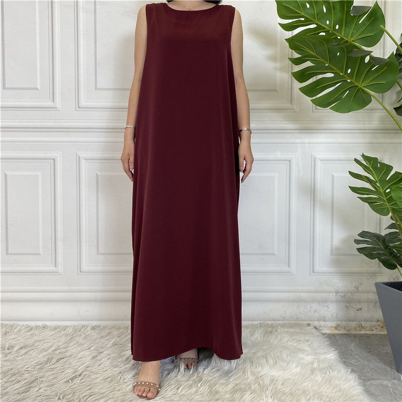 A new Muslim dress with a simple sleeveless base made of plain Nida fabric, which is selling well in the Middle East, Dubai, Arab and African regions