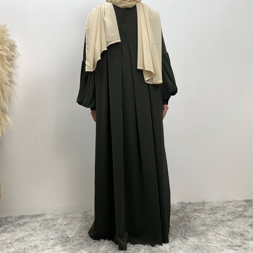 n with poThe new Middle Eastern Muslim women's round-neck abaya dress, an elegant solid-color summer pleated dress for Islamic womeckets