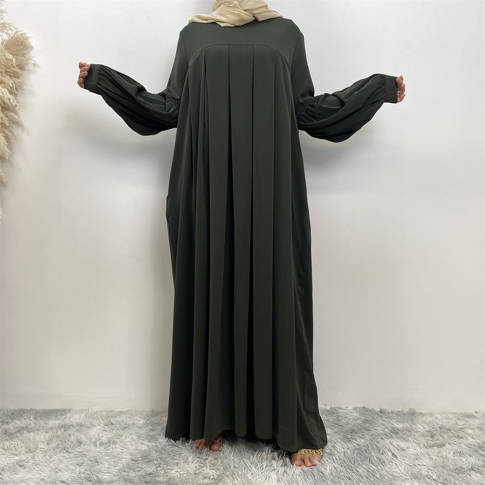 n with poThe new Middle Eastern Muslim women's round-neck abaya dress, an elegant solid-color summer pleated dress for Islamic womeckets