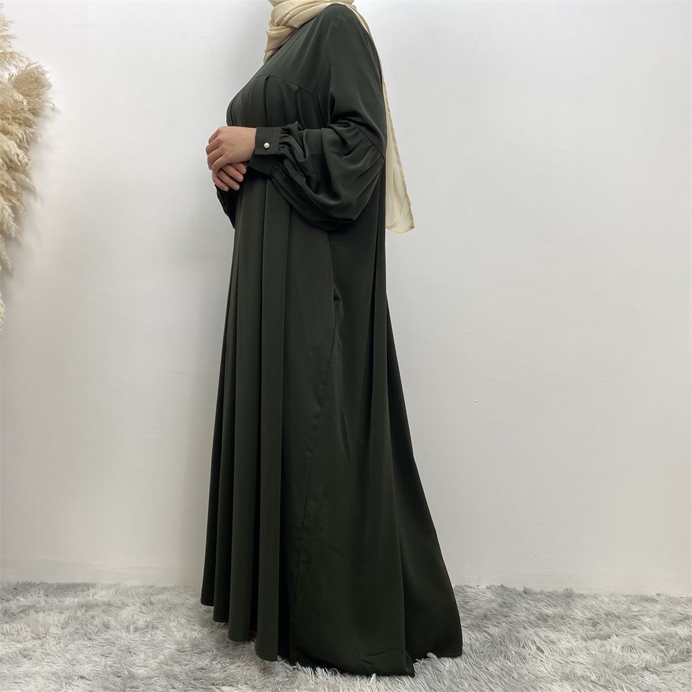 n with poThe new Middle Eastern Muslim women's round-neck abaya dress, an elegant solid-color summer pleated dress for Islamic womeckets