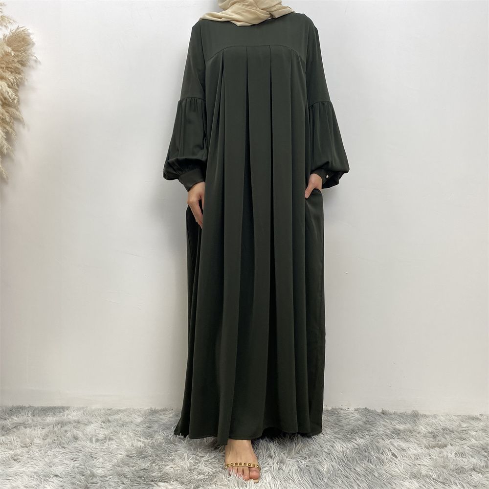n with poThe new Middle Eastern Muslim women's round-neck abaya dress, an elegant solid-color summer pleated dress for Islamic womeckets