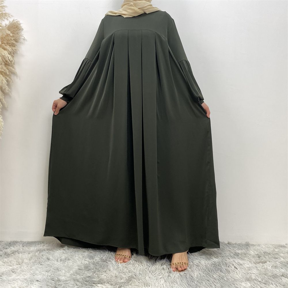 n with poThe new Middle Eastern Muslim women's round-neck abaya dress, an elegant solid-color summer pleated dress for Islamic womeckets