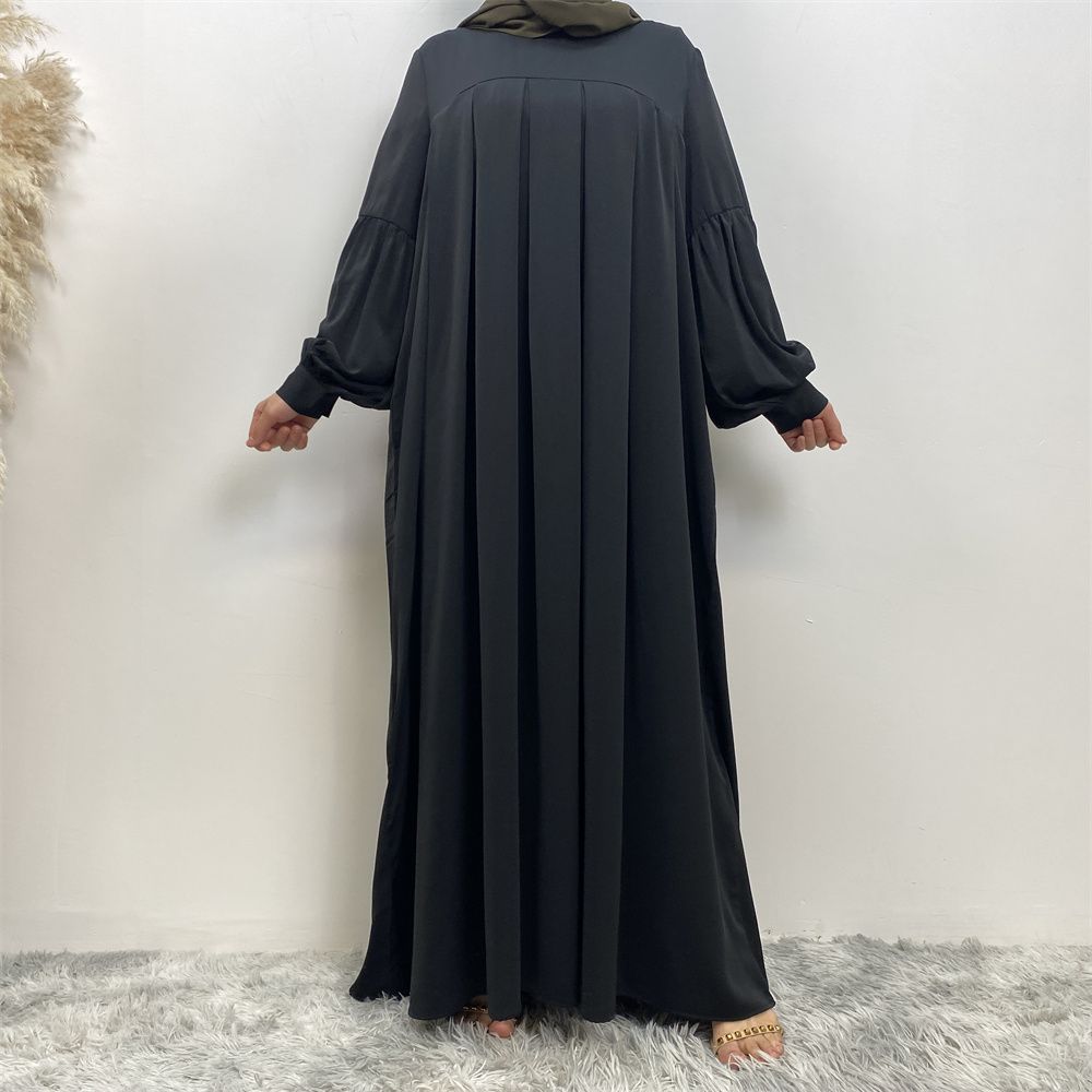 n with poThe new Middle Eastern Muslim women's round-neck abaya dress, an elegant solid-color summer pleated dress for Islamic womeckets