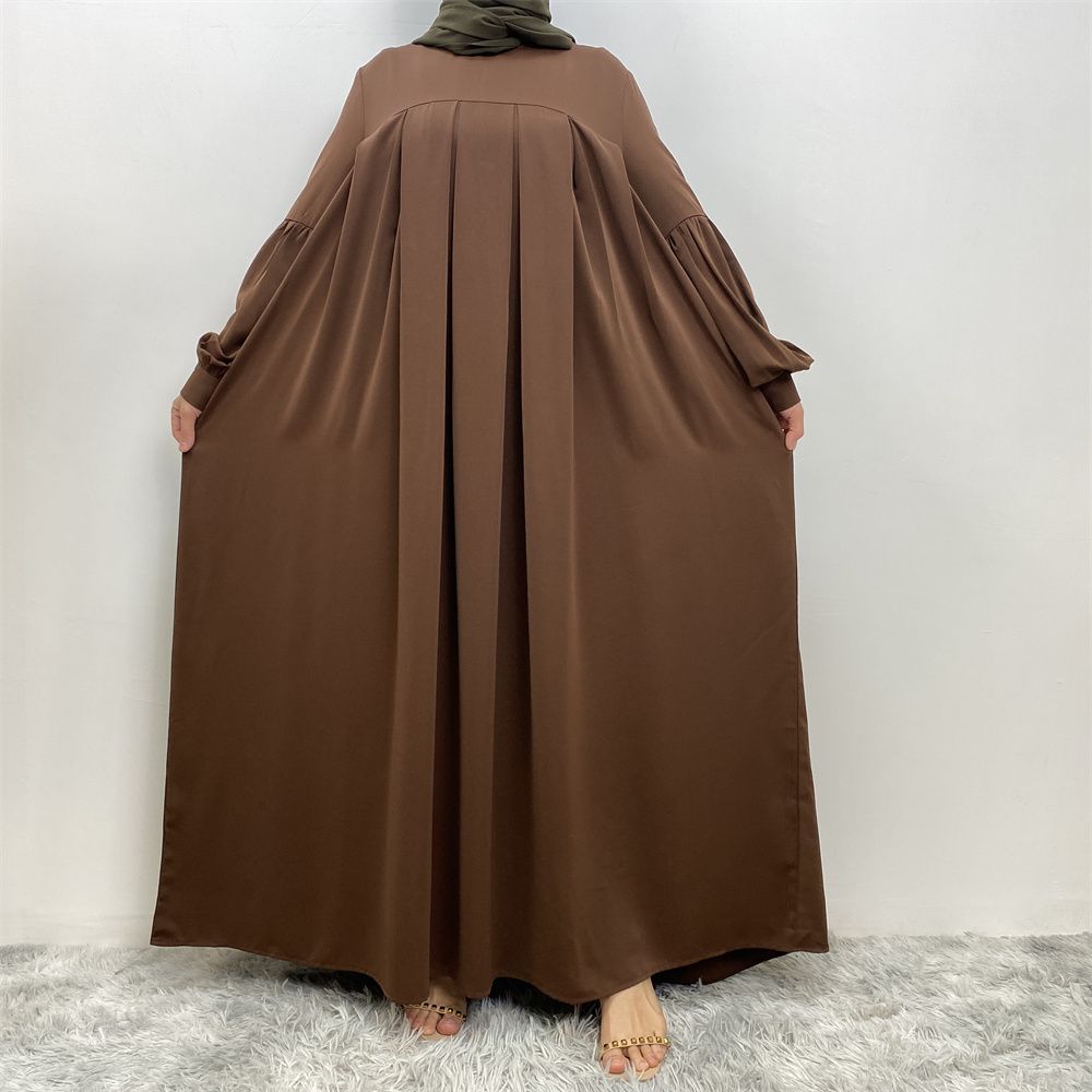 n with poThe new Middle Eastern Muslim women's round-neck abaya dress, an elegant solid-color summer pleated dress for Islamic womeckets