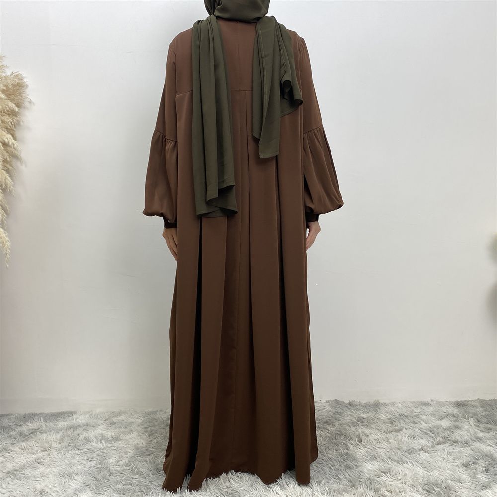 n with poThe new Middle Eastern Muslim women's round-neck abaya dress, an elegant solid-color summer pleated dress for Islamic womeckets