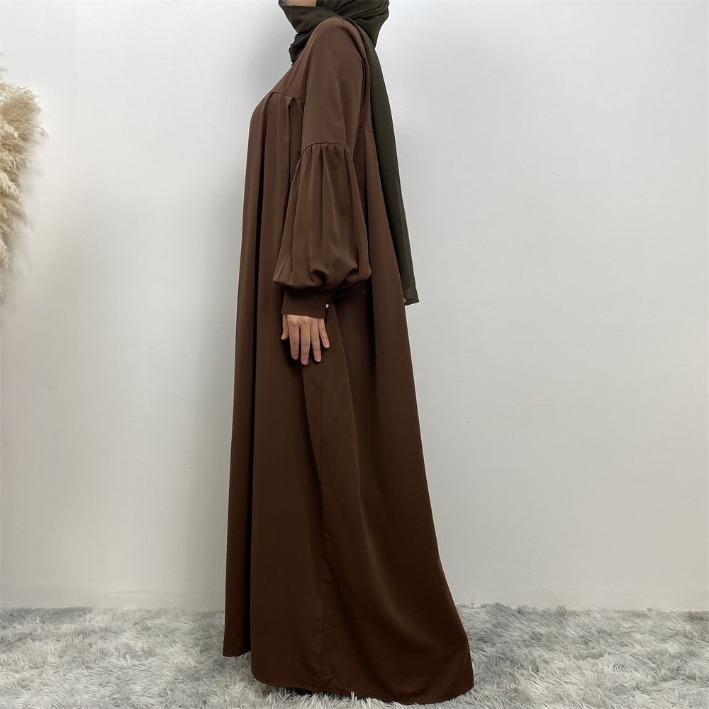n with poThe new Middle Eastern Muslim women's round-neck abaya dress, an elegant solid-color summer pleated dress for Islamic womeckets