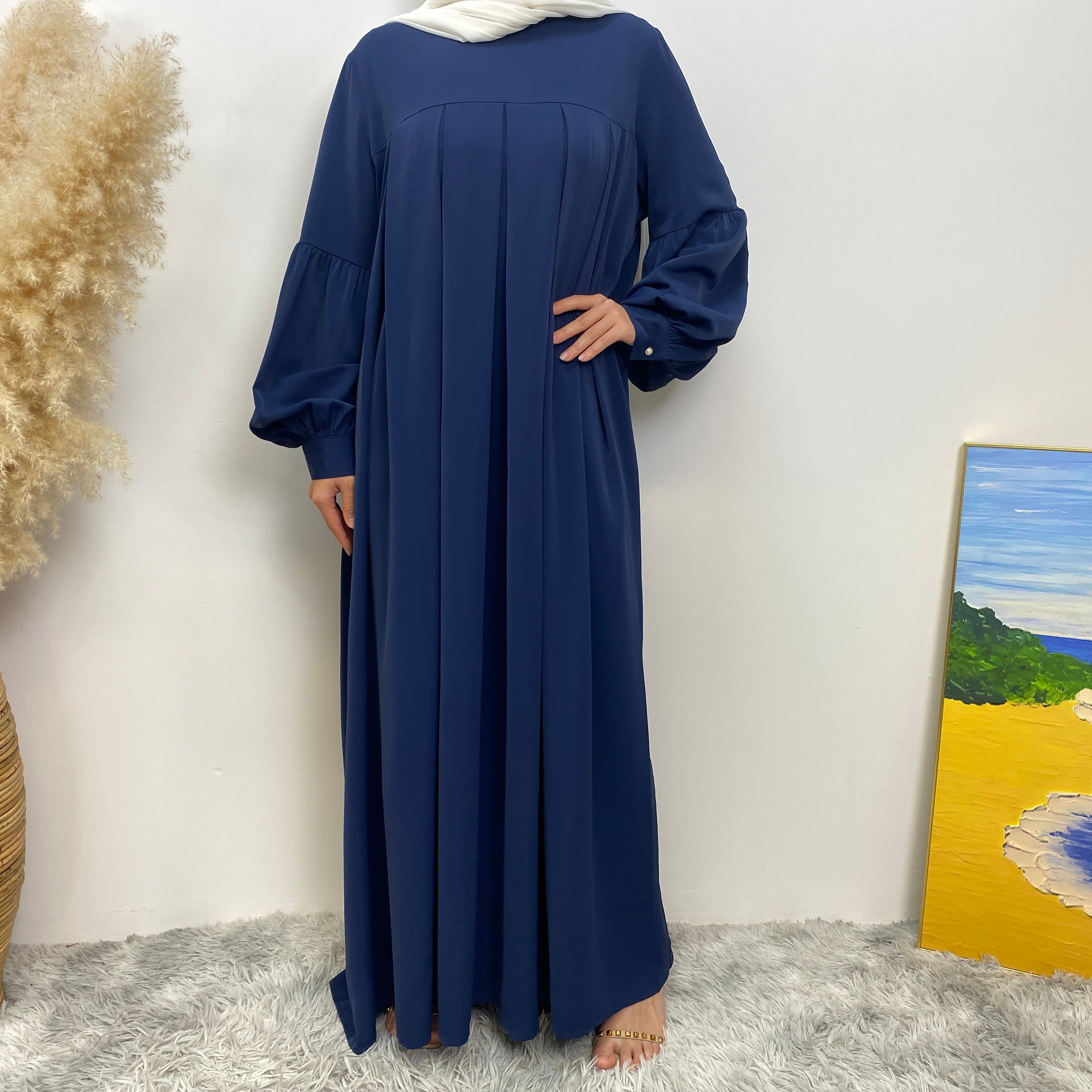 n with poThe new Middle Eastern Muslim women's round-neck abaya dress, an elegant solid-color summer pleated dress for Islamic womeckets