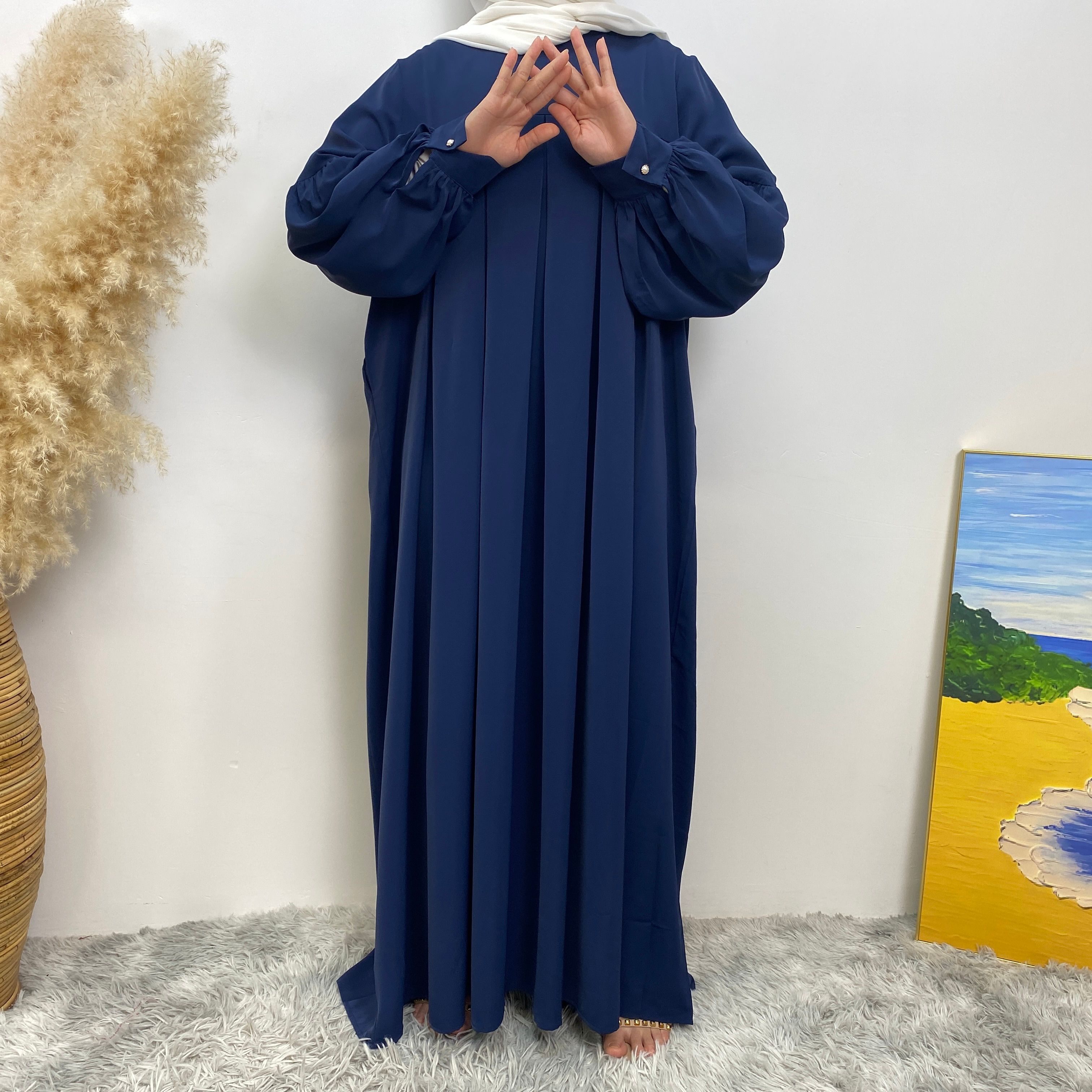 n with poThe new Middle Eastern Muslim women's round-neck abaya dress, an elegant solid-color summer pleated dress for Islamic womeckets