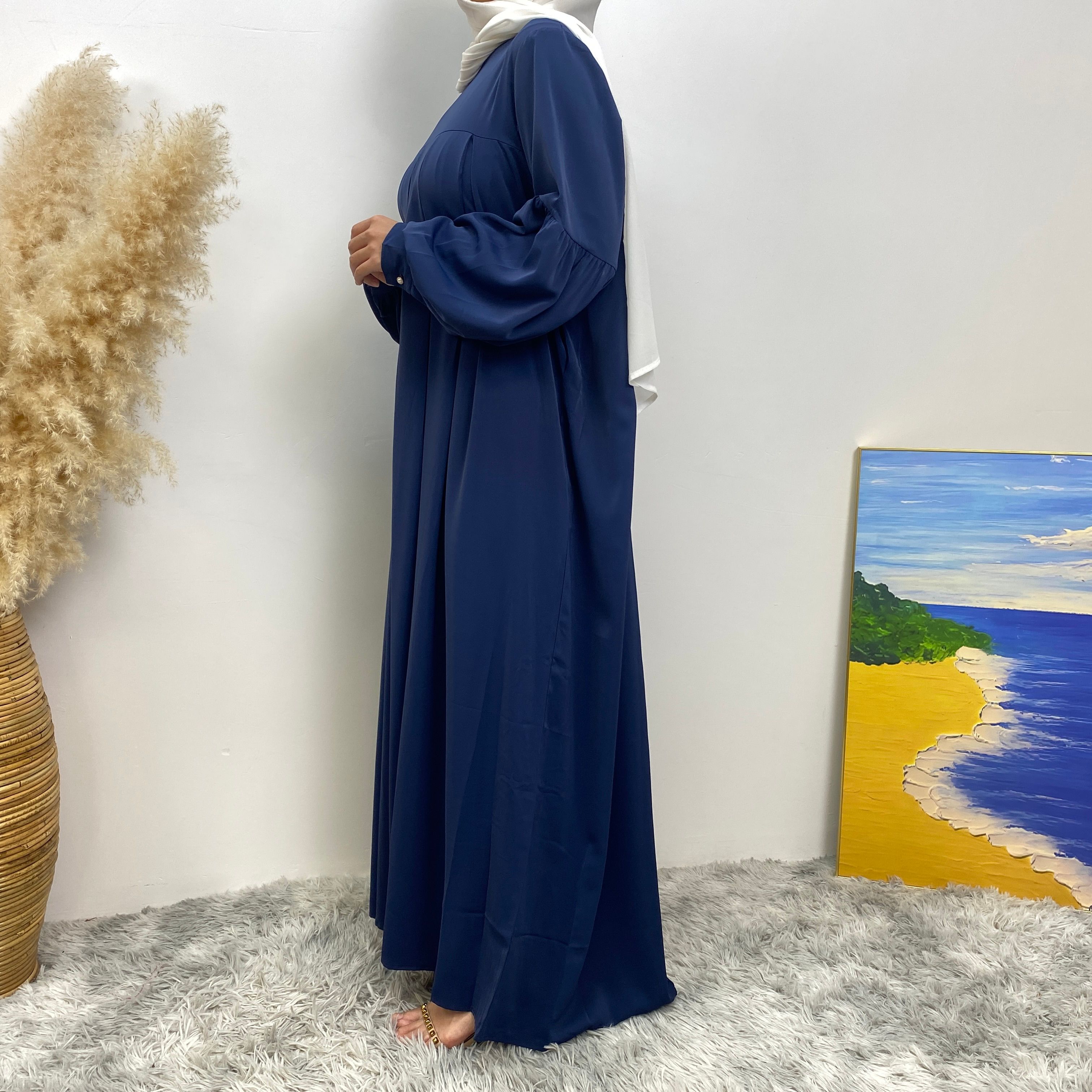 n with poThe new Middle Eastern Muslim women's round-neck abaya dress, an elegant solid-color summer pleated dress for Islamic womeckets