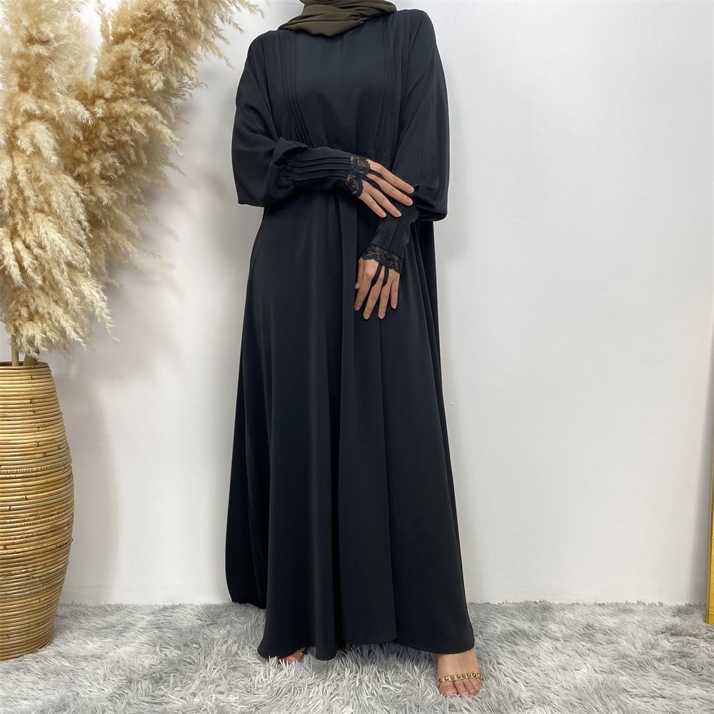 A simple and luxurious Muslim Middle Eastern woman's dress with lace zippers, an Islamic Turkish pleated front zipper, and an Arab Turkish cardigan robe