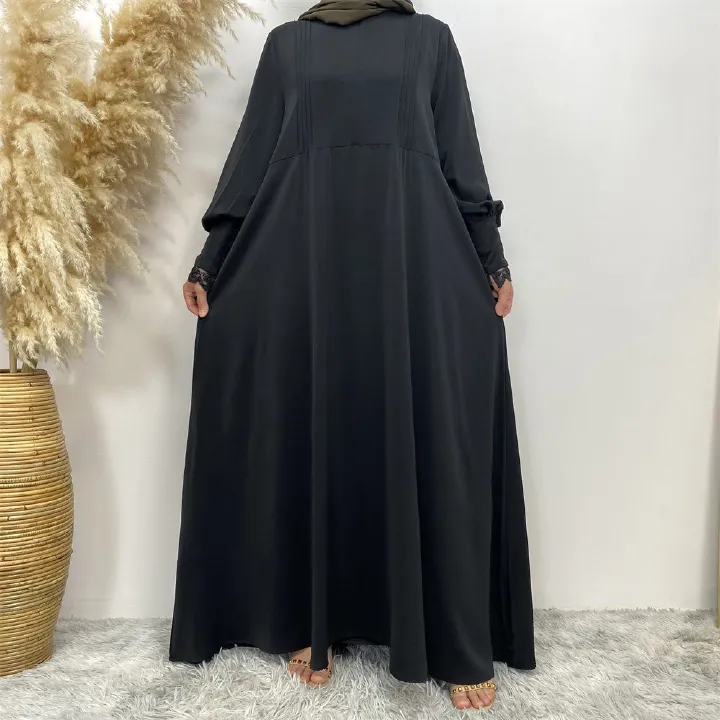 A simple and luxurious Muslim Middle Eastern woman's dress with lace zippers, an Islamic Turkish pleated front zipper, and an Arab Turkish cardigan robe
