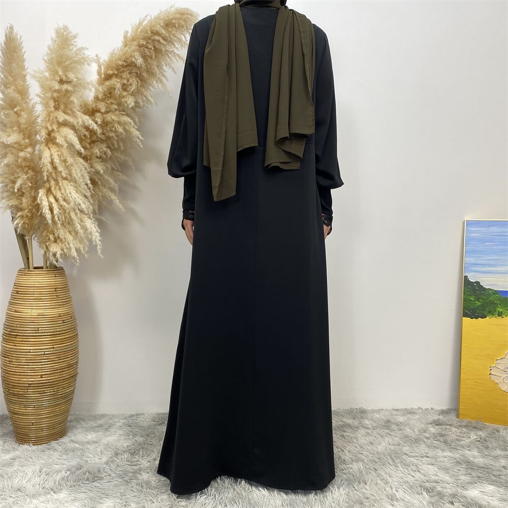 A simple and luxurious Muslim Middle Eastern woman's dress with lace zippers, an Islamic Turkish pleated front zipper, and an Arab Turkish cardigan robe