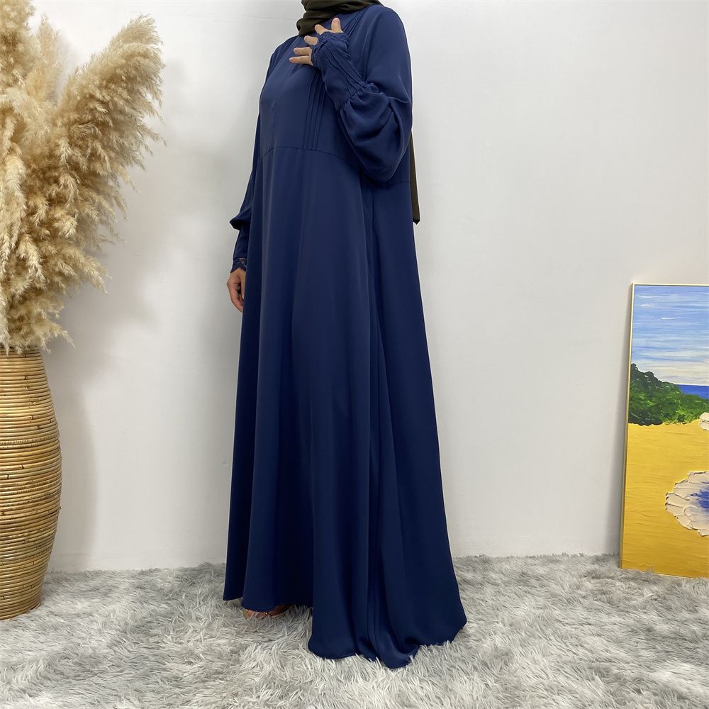 A simple and luxurious Muslim Middle Eastern woman's dress with lace zippers, an Islamic Turkish pleated front zipper, and an Arab Turkish cardigan robe