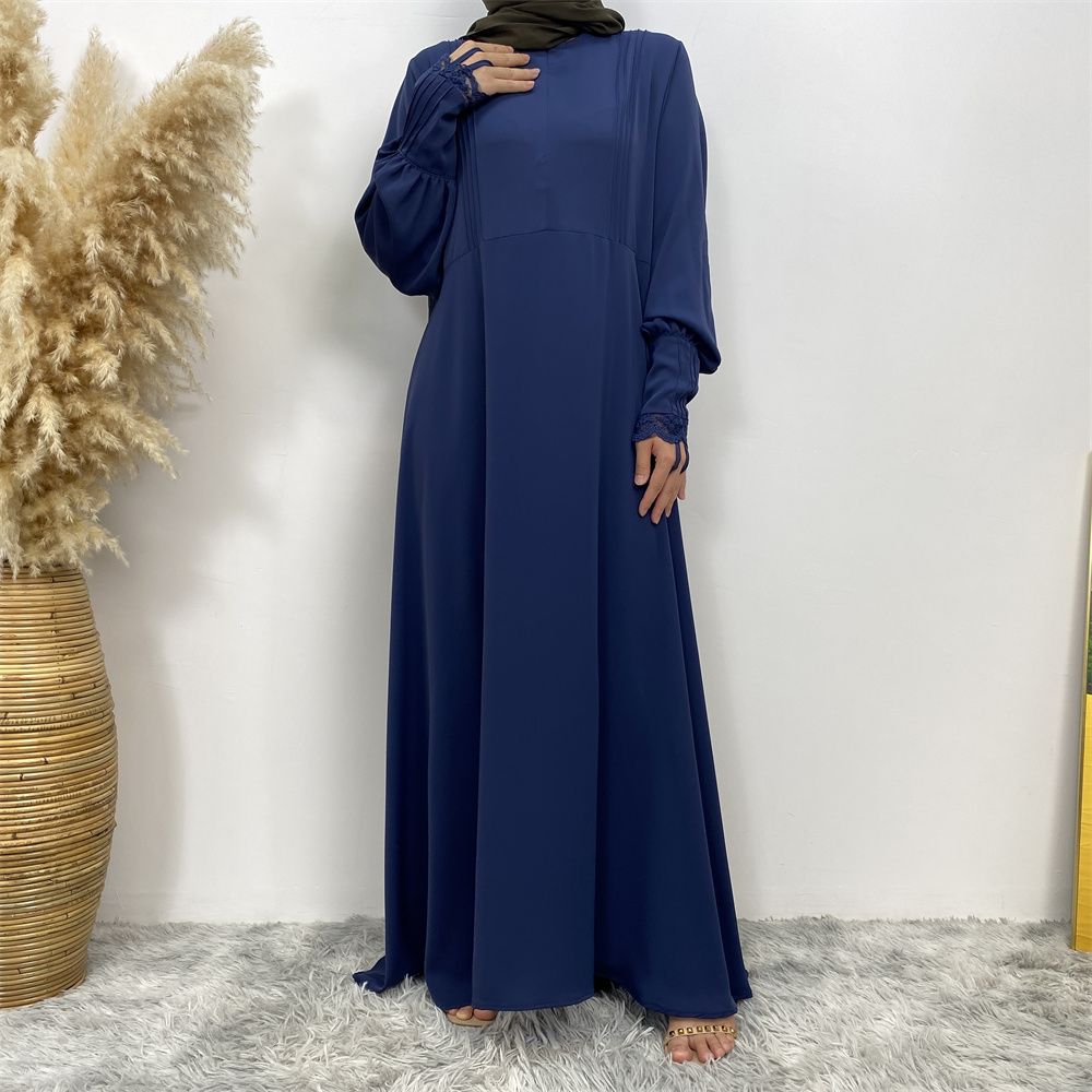 A simple and luxurious Muslim Middle Eastern woman's dress with lace zippers, an Islamic Turkish pleated front zipper, and an Arab Turkish cardigan robe